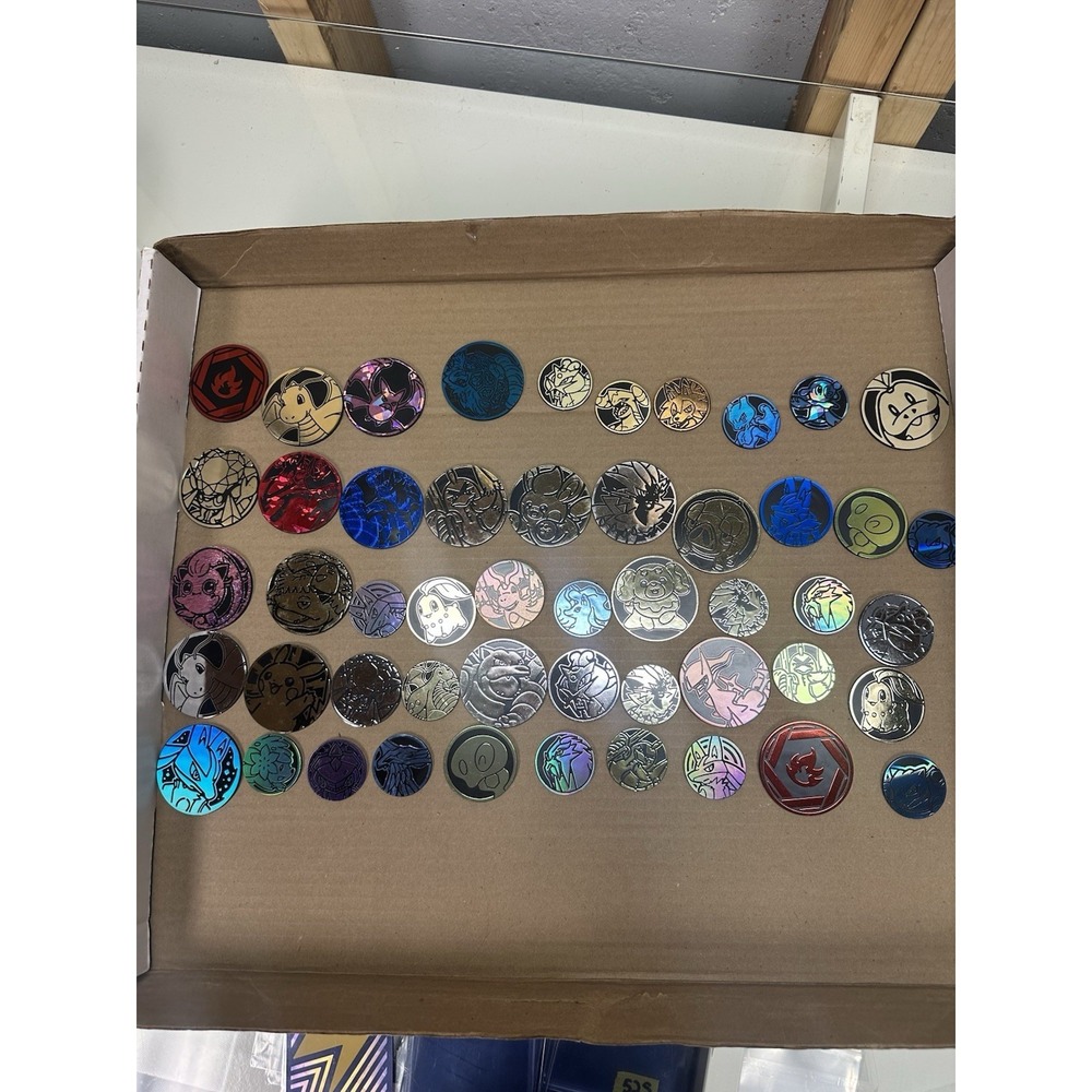 Pokémon TCG - 50 Official Coin Lot  Mixed Years & Styles, Varying Condition!